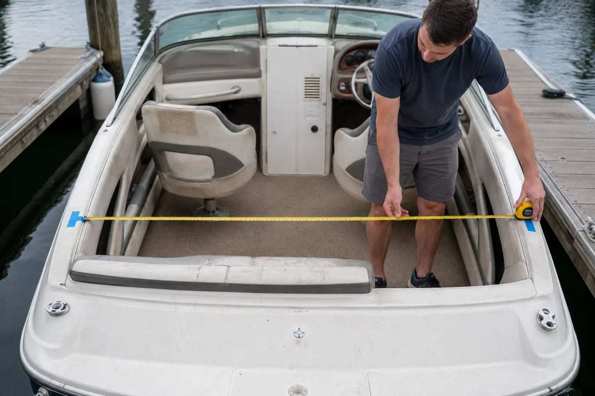 AI-generated technical illustration of a boat owner measuring mounting-point width before ordering a bimini top.