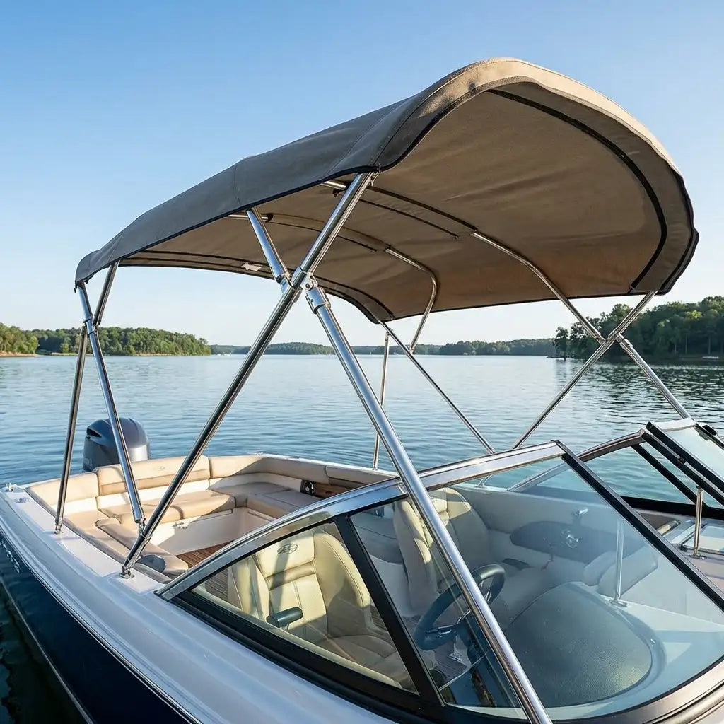 View of an installed bimini top canvas and frame on a boat at sunset, showing the application of marine hardware in a nautical environment.