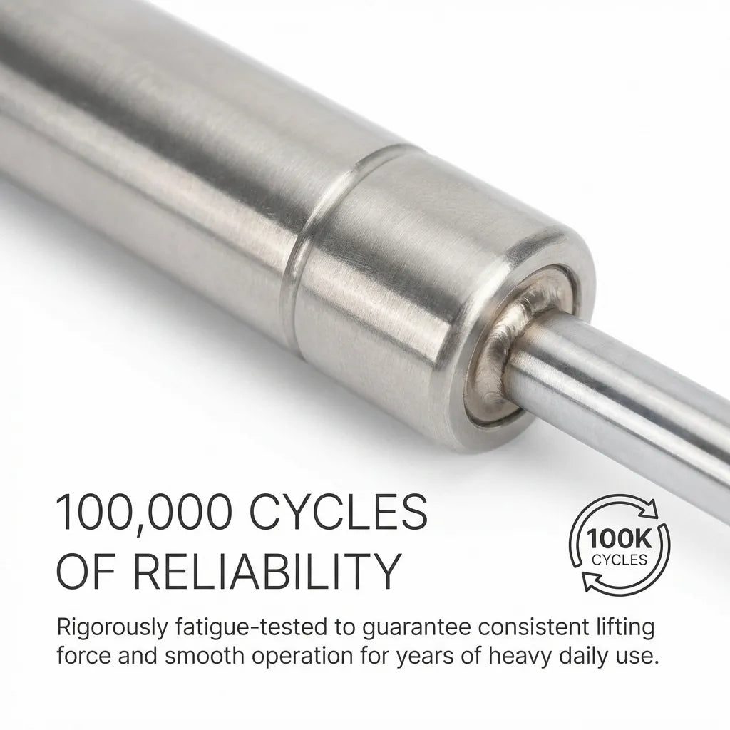 Macro shot of the gas spring rod seal and tube junction showing the high-precision weld and smooth surface finish for 100,000 cycle reliability.