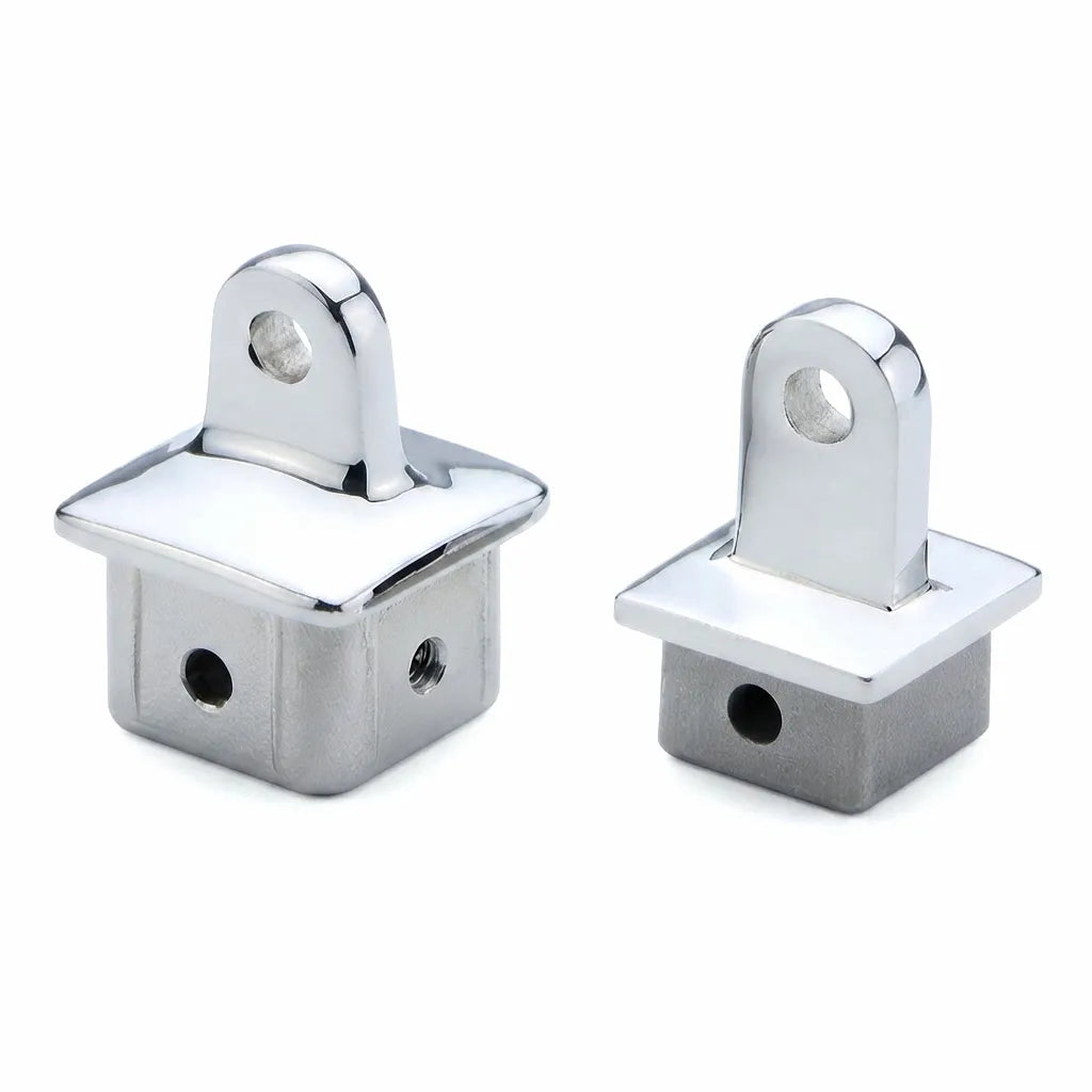 Close-up of two mirror-polished 316 Stainless Steel 32mm square tube end caps and sliding caps for marine applications, highlighting precision finish and screw holes for secure mounting.