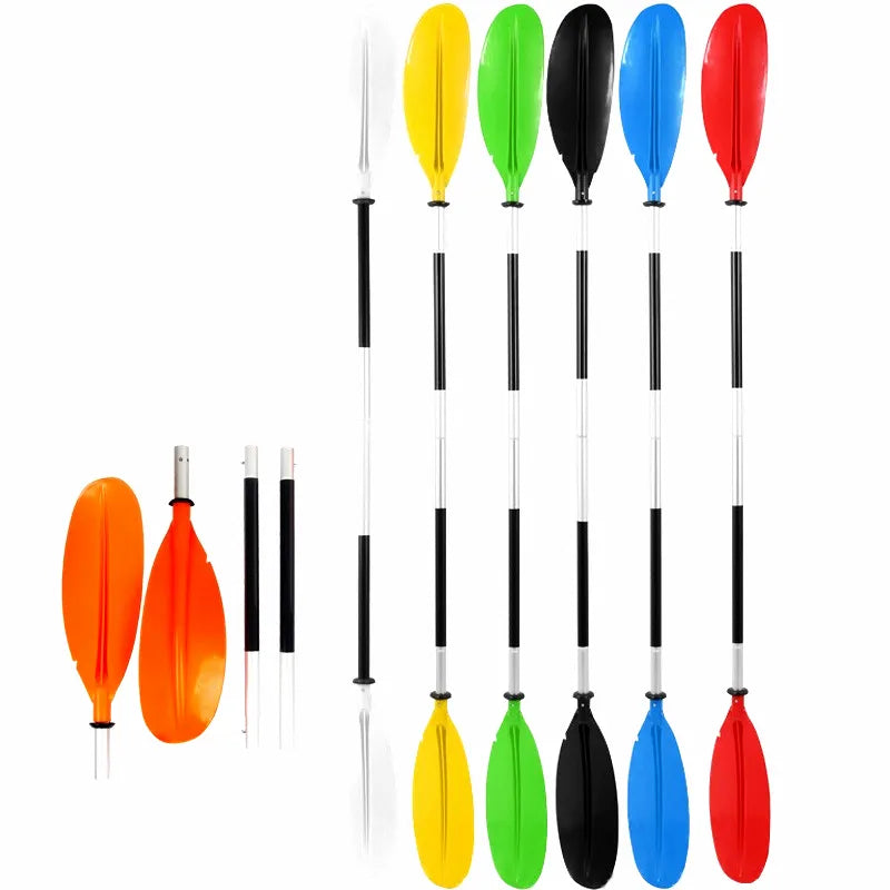 Collection of modular 4-section double-bladed kayak canoe paddles in white, yellow, green, black, blue, and red, featuring lightweight aluminum alloy shafts and high-impact plastic blades