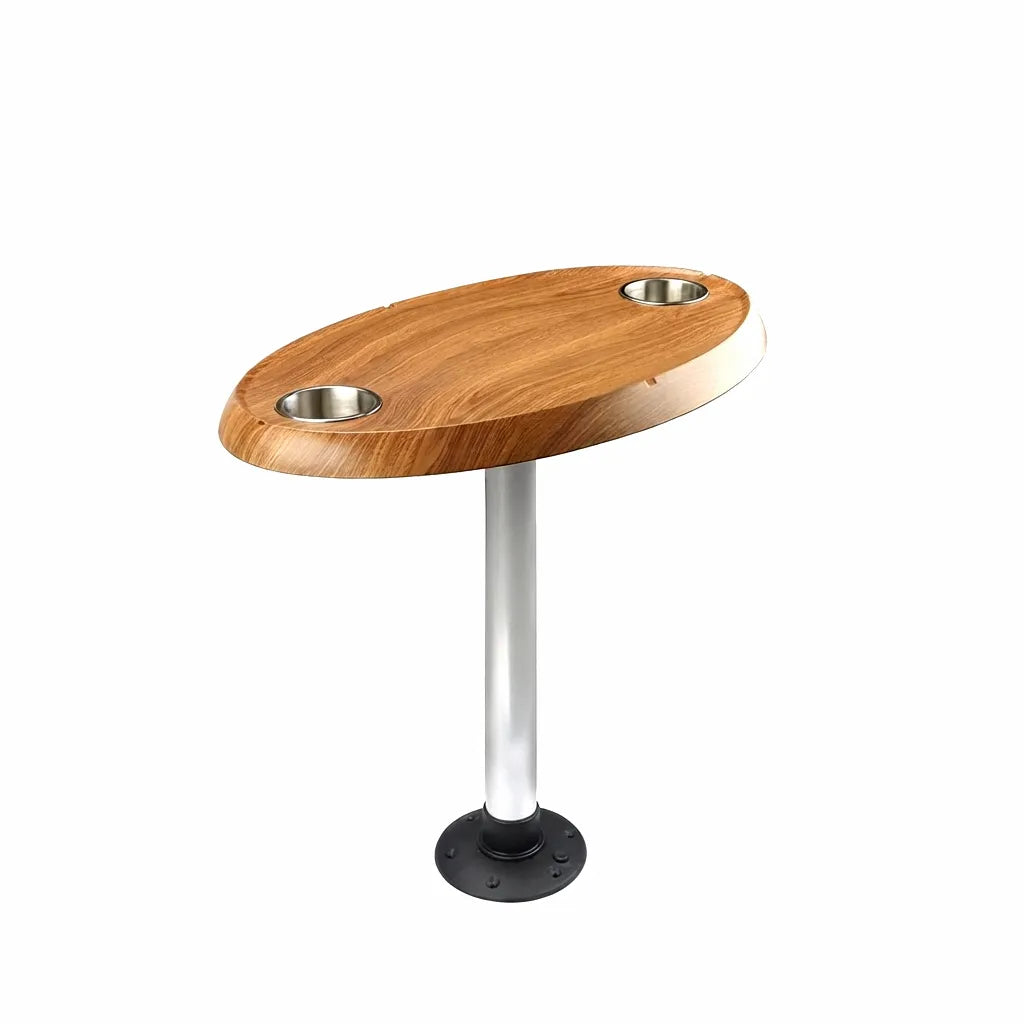 Premium oval teak wood boat table with dual recessed stainless steel cup holders mounted on a sleek silver pedestal with a black deck flange base, shown on a pure white background.
