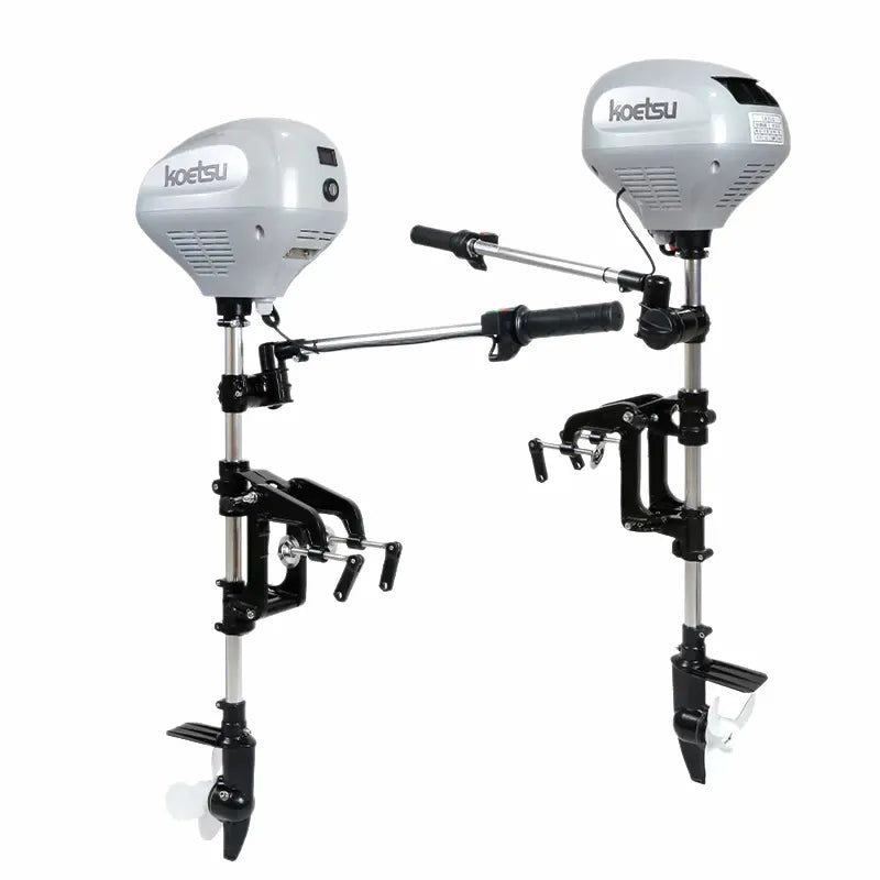 Two Koetsu brushless electric outboard motors on a pure white background, showcasing their ergonomic handles, multi-angle transom brackets, and propellers.