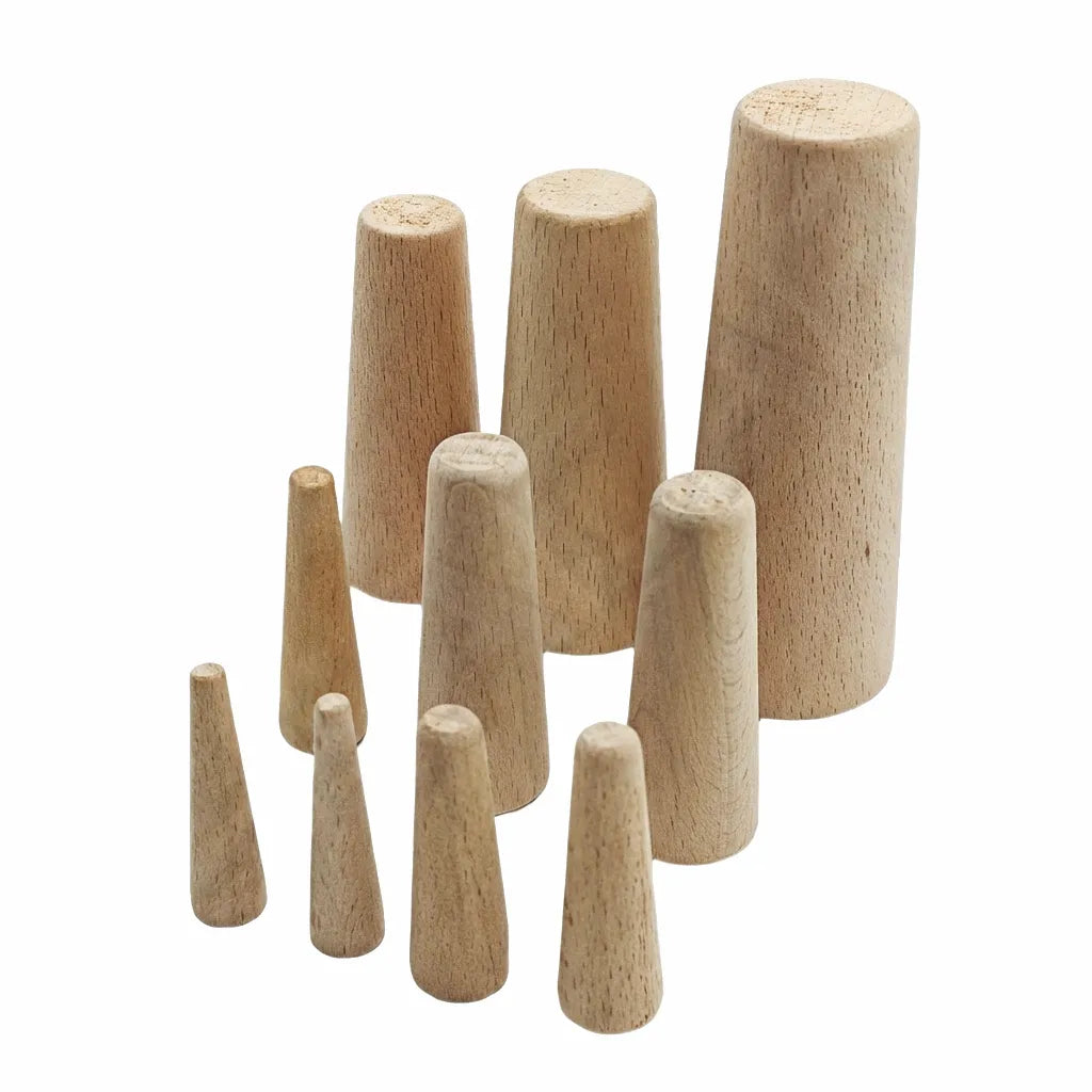 A 10-piece set of assorted tapered softwood emergency marine plugs arranged on a white background for boat leak repair.