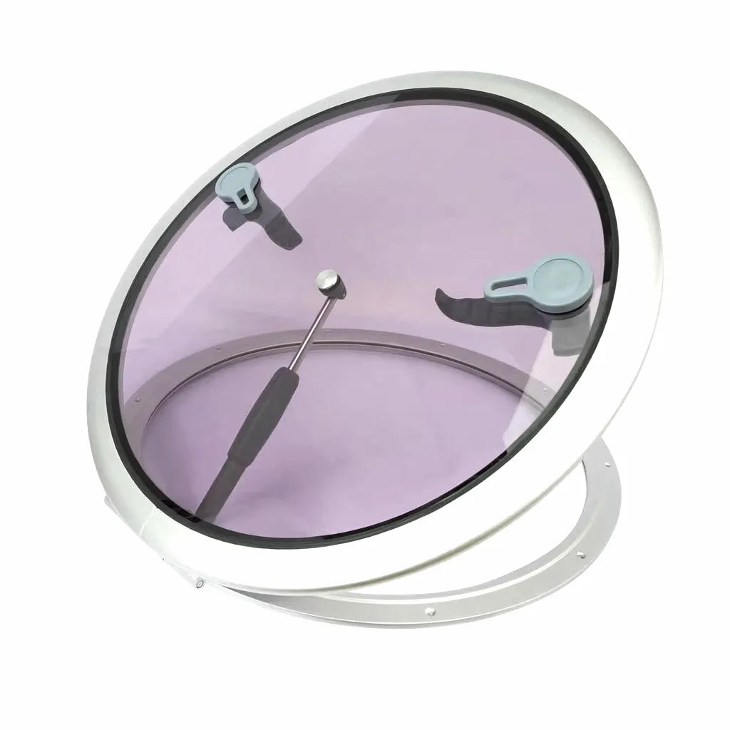 Hero shot of a round marine deck hatch featuring a silver anodized aluminum frame and tinted purple acrylic glazing on a white background.