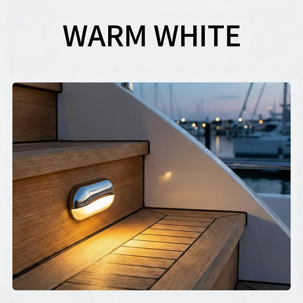Lifestyle application of a warm white LED step light installed on teak wood yacht stairs at dusk, showing light throw pattern and aesthetic ambiance.