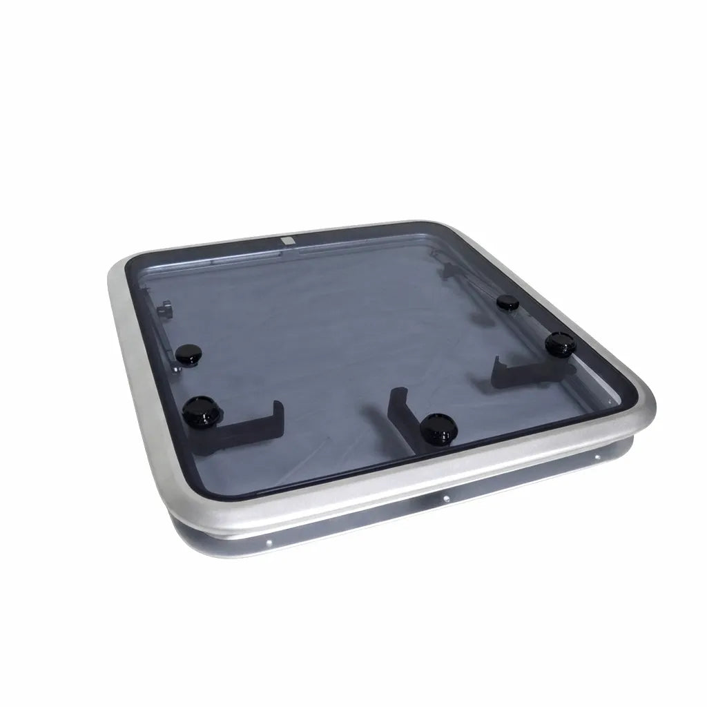 Low-profile marine deck hatch escape window featuring an anodized aluminum frame and tinted tempered glass lens on a white background.