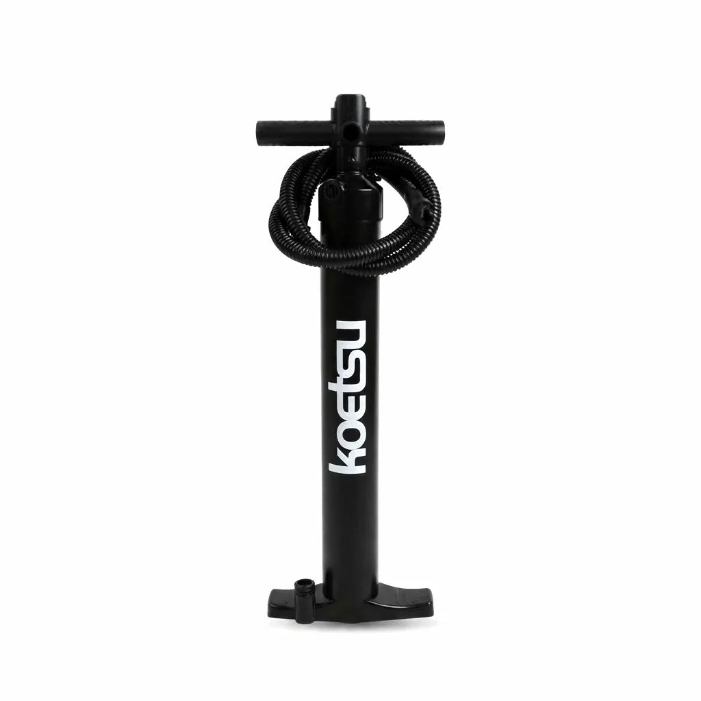 Koetsu Dual-Action High-Pressure Hand Pump for Surfboards, Paddleboards, and Inflatable Boats. Features a robust matte black polymer body, comfortable T-handle, reinforced hose, and universal valve adapter, isolated on a pure white background.