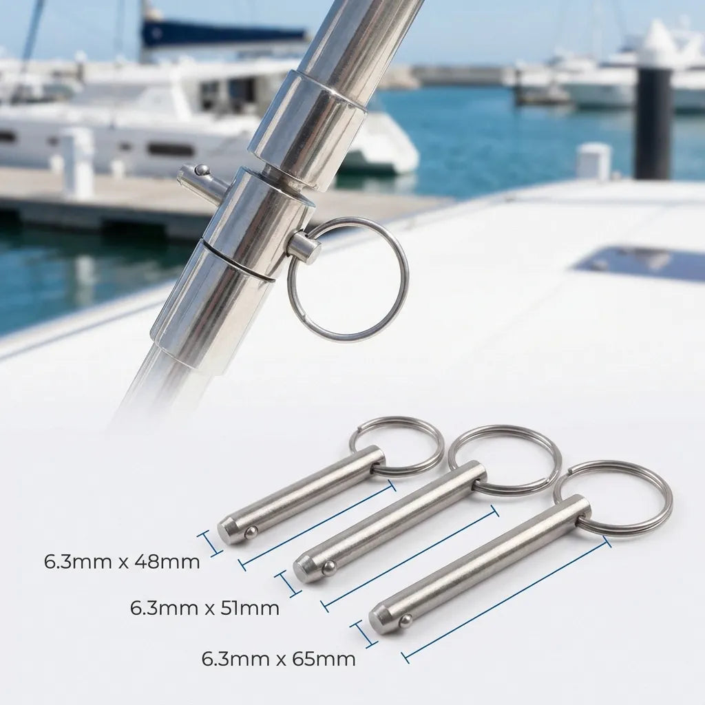 Quick release pin installed in a stainless steel marine jaw slide on a boat bimini top frame with a marina and luxury yachts in the background.